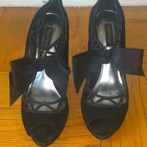 Black suede heels with a black bow (size 8M)